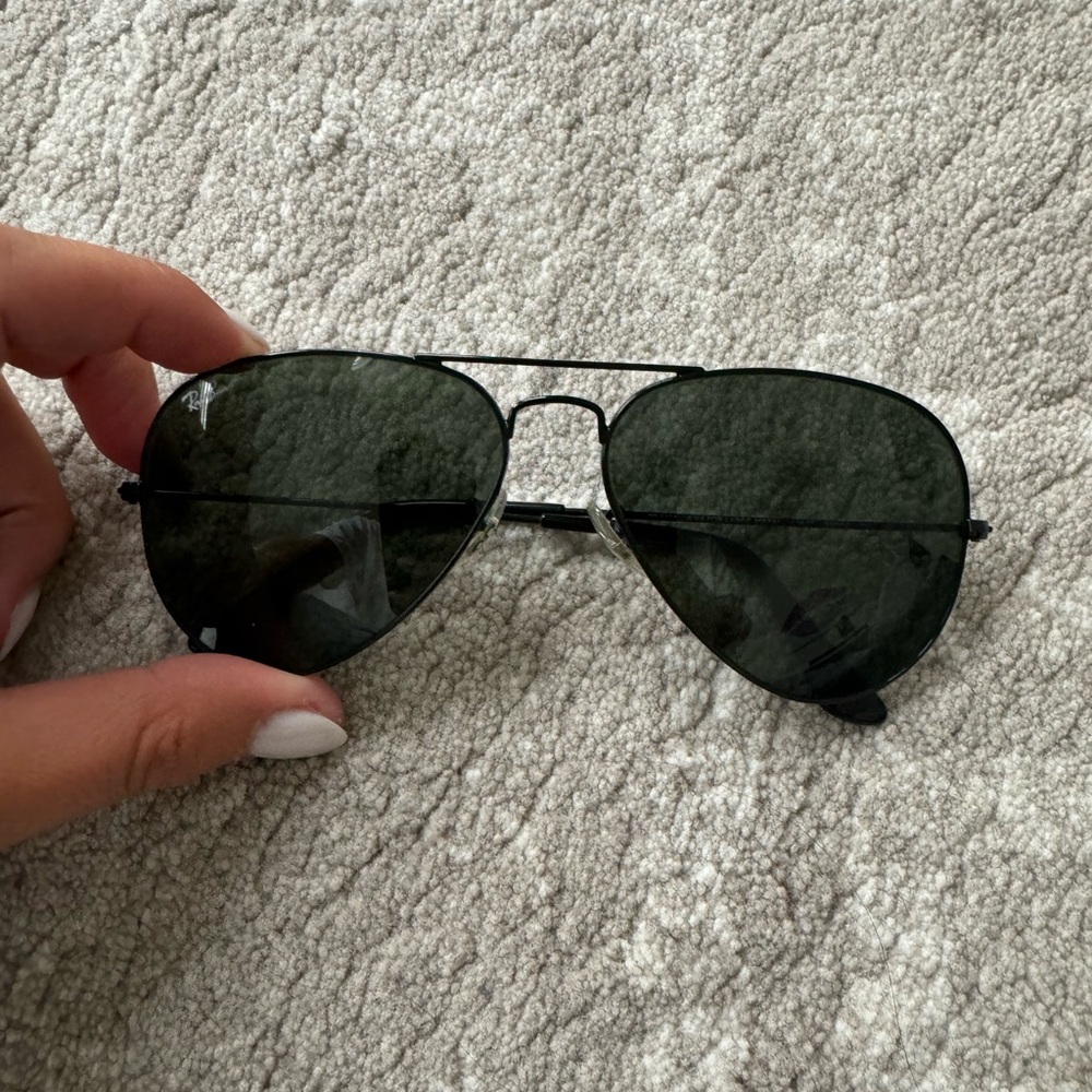 Aviator blacked out ray bans.